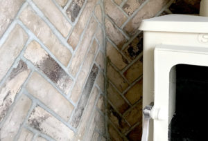 herringbone-brick-tile-fireplace